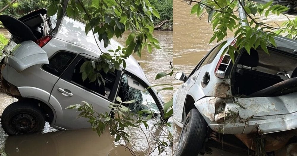 Carro caído às margens do Rio Uberabinha em Uberlândia — Foto: Bombeiros